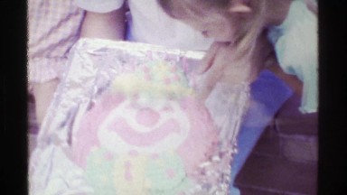 1958: Dad bakes birthday party clown cake homemade aluminum foil pan daughters.