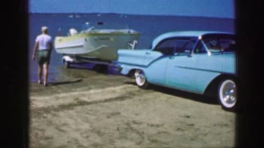 1961: A Boat Is Seen Brought Into Water Being Pushed Down by a Car Iowa
