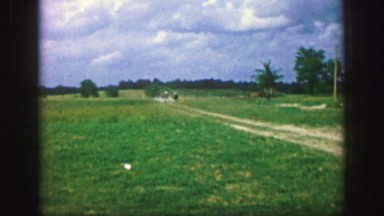 1961: two horse riders approaching and one of them is faster to race his mount