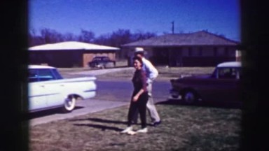 1961: the scene shows people moving in a farm scene or area and seem very happy