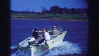 1961: a family is seen sitting on a boat and having a ride IOWA