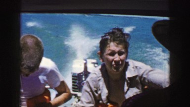1961: two young boys riding in a boat with a powerful outboard engine IOWA