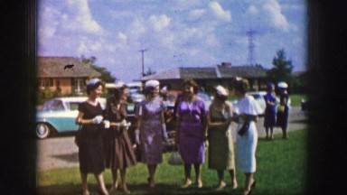 1961: women are seen posing and having a nice time IOWA