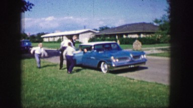 1961: children are seen throwing things at a car in fun IOWA
