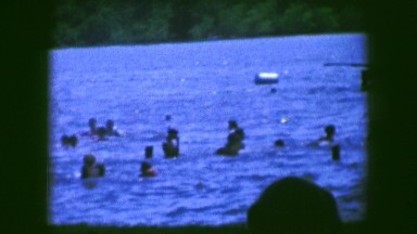 1961: an outdoor beach is seen with people diving in the water IOWA