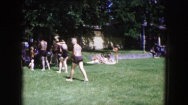 1961: sunbathers enjoy fun day in the sun stroll through park IOWA