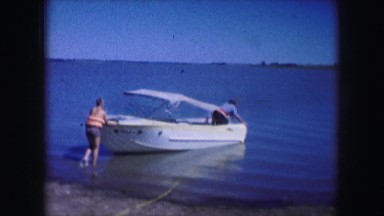 1961: a boat is seen brought into water being pushed down by people IOWA