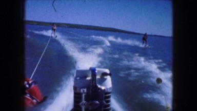 1961: water skiing with friends on the lake in the sun IOWA