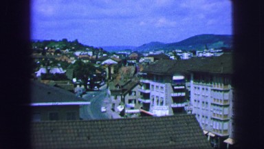 1963: Scenic View of a Small French City Set Against Mountains