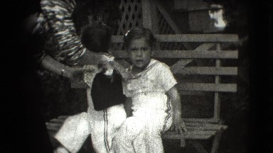 1942: Two Sisters Sitting Together on Sofa in Cottonwood, Arizona