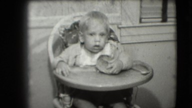 1942: expressive child with bread COTTONWOOD, ARIZONA