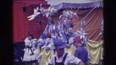 1948: people in colorful, elaborate costumes preparing for event CHICAGO,