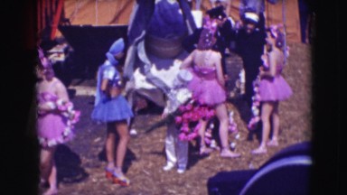 1948: a circus is being set up, people are seen bringing their props they need