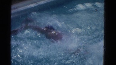 1953: Man Swimming Laps in Backyard Pool, Cottonwood, Arizona