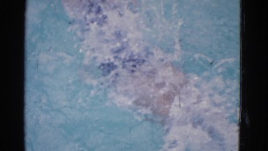 1953: woman doing the backstroke in an outdoor pool COTTONWOOD, ARIZONA