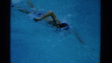 1953: in this video children are seen swimming and racing each other.