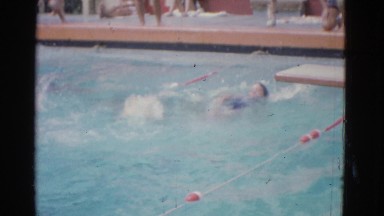 1953: this video is of the last lap of a women's backstroke swimming competition