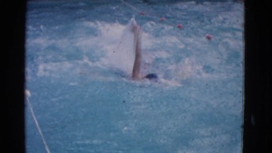 1953: man swimming in a pool. COTTONWOOD, ARIZONA