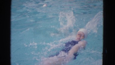 1953: female swimmer backstrokes all way to achieve her desired success