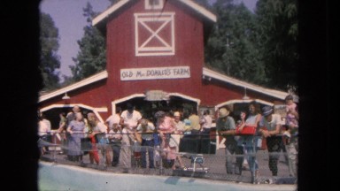 1962: People Watching Sea Lions and Seals in Water Enclosure, San Pedro, California