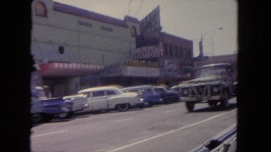 1962: driving down a road in the backseat of a car SAN PEDRO, CALIFORNIA
