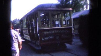 1962: a trolley travels down a street SAN PEDRO, CALIFORNIA