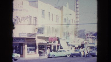 1962: this is a video of a busy intersection from the 1960's. the pedestrians