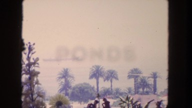 1962: standing on the beach, watching a ship go by. SAN PEDRO, CALIFORNIA