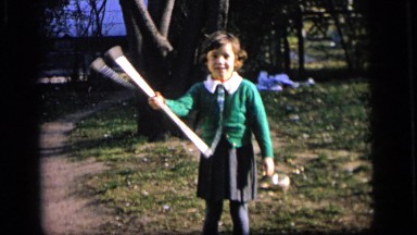 1964: young female tossing a stick CAMDEN, NEW JERSEY