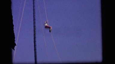 1964: the video shows a scene of a thrill park in which a person is climbing