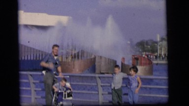 1964: father and children enjoying fountains CAMDEN, NEW JERSEY