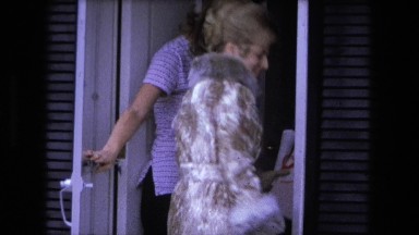1973: Lady in Golden Overcoat Waves and Calls 'Come In, I Am Waiting for You'