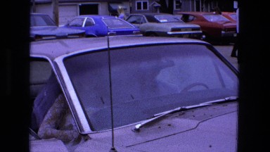 1973: Newly Married Couple Standing By Classic Car in Parking Lot