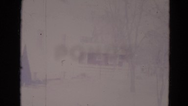 1974: Viewing a House in a 1970s Suburban Neighborhood