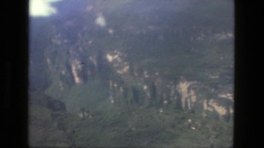 1979: Aerial View of Clouds and Water from Plane Window