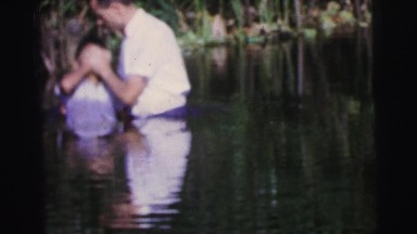 1979: Three Young People of Different Origins Being Baptized in a Body of Water