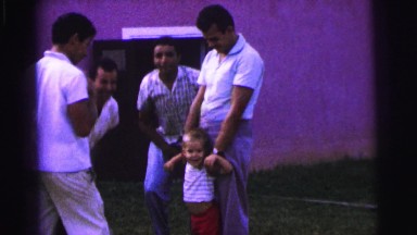 1979: little blonde boy is the center of attention from four men