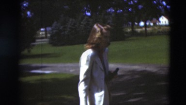1951: a young woman celebrating the graduation day with the family WILLMAR