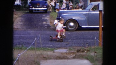 1954: little girl having fun on her bike HICKSVILLE, NEW YORK