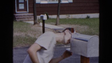 1954: family man checking the mail very anxiously HICKSVILLE, NEW YORK
