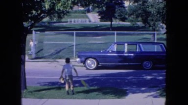 1954: young boy plays on the sidewalk. NEW YORK