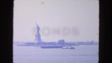 1954: distant view of the statue of liberty in new york city attraction