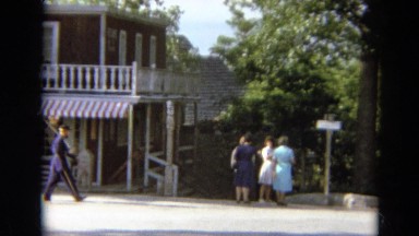 1968: A Security Man Walks a Busy Street in Silver City, Nevada