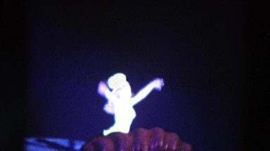 1969: girl finishing her ice skating routine showing audience her gratitude
