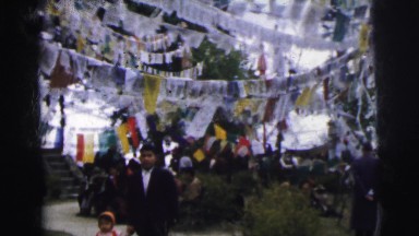 1962: father and daughter walk through festival BANGKOK, THAILAND