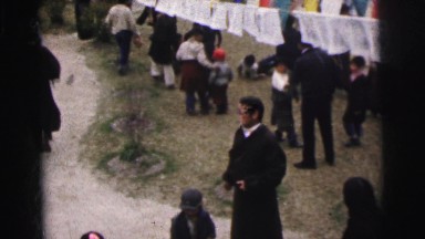 1962: many men of all ages are having a get together in this far away place.
