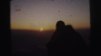 1962: a couple is seen together watching a sunset BANGKOK, THAILAND