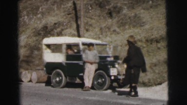 1962: a person is seen standing beside a jeep BANGKOK, THAILAND