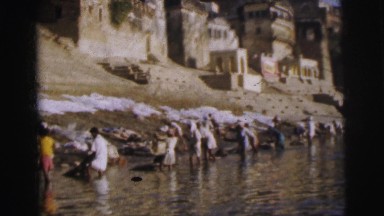 1962: laundry scene is seen with people washing clothes in a water body BANGKOK,