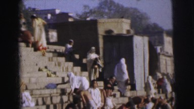 1962: People Bathing in Ritual as Boat Passes by in Bangkok